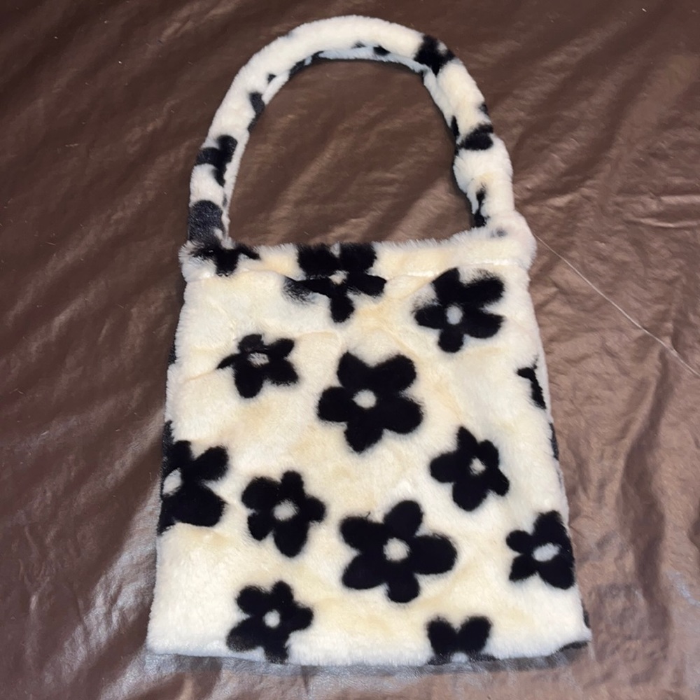 White and black flowered bag